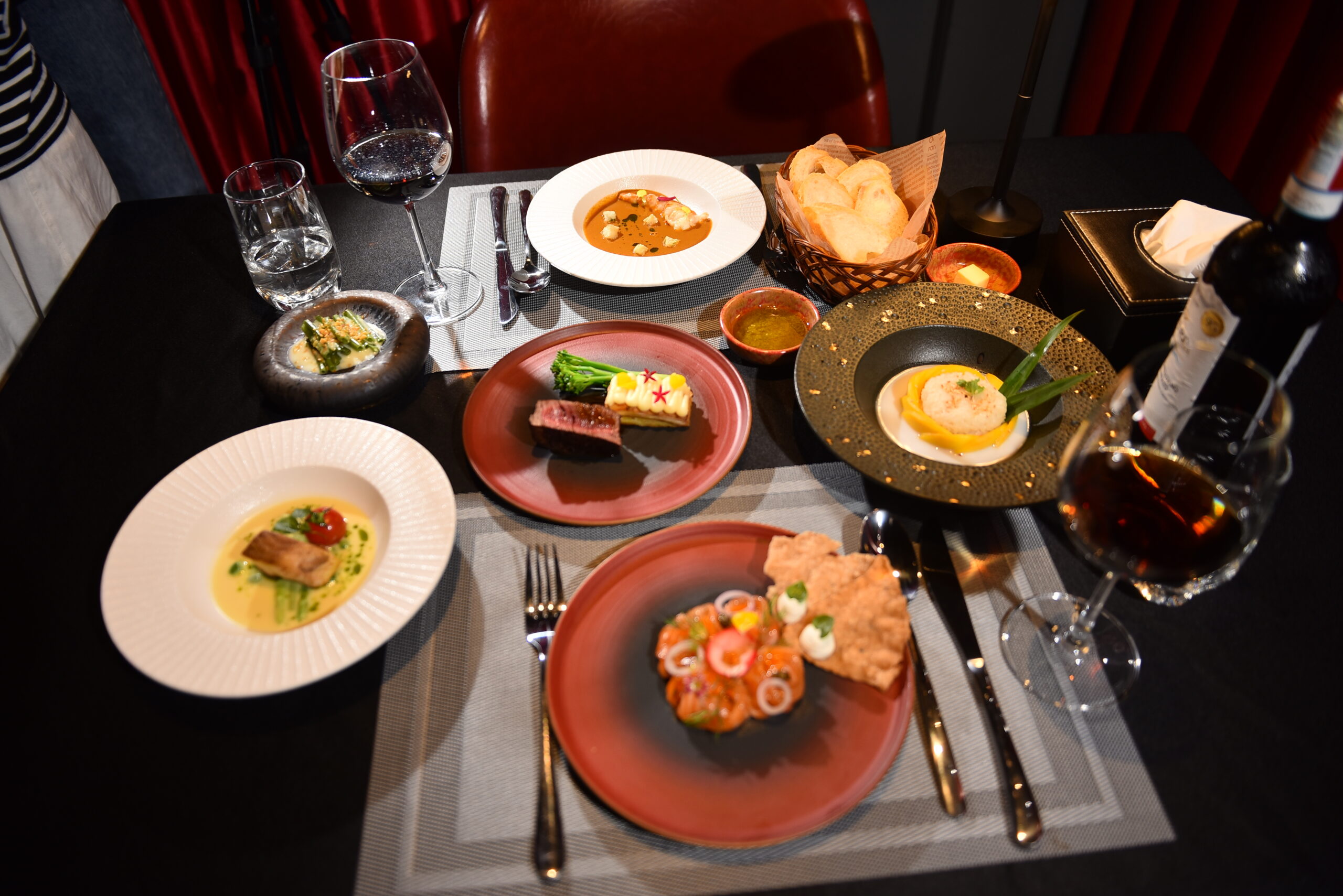 Fine dining course with beautifully plated dishes at Moulin de Danang in Da Nang