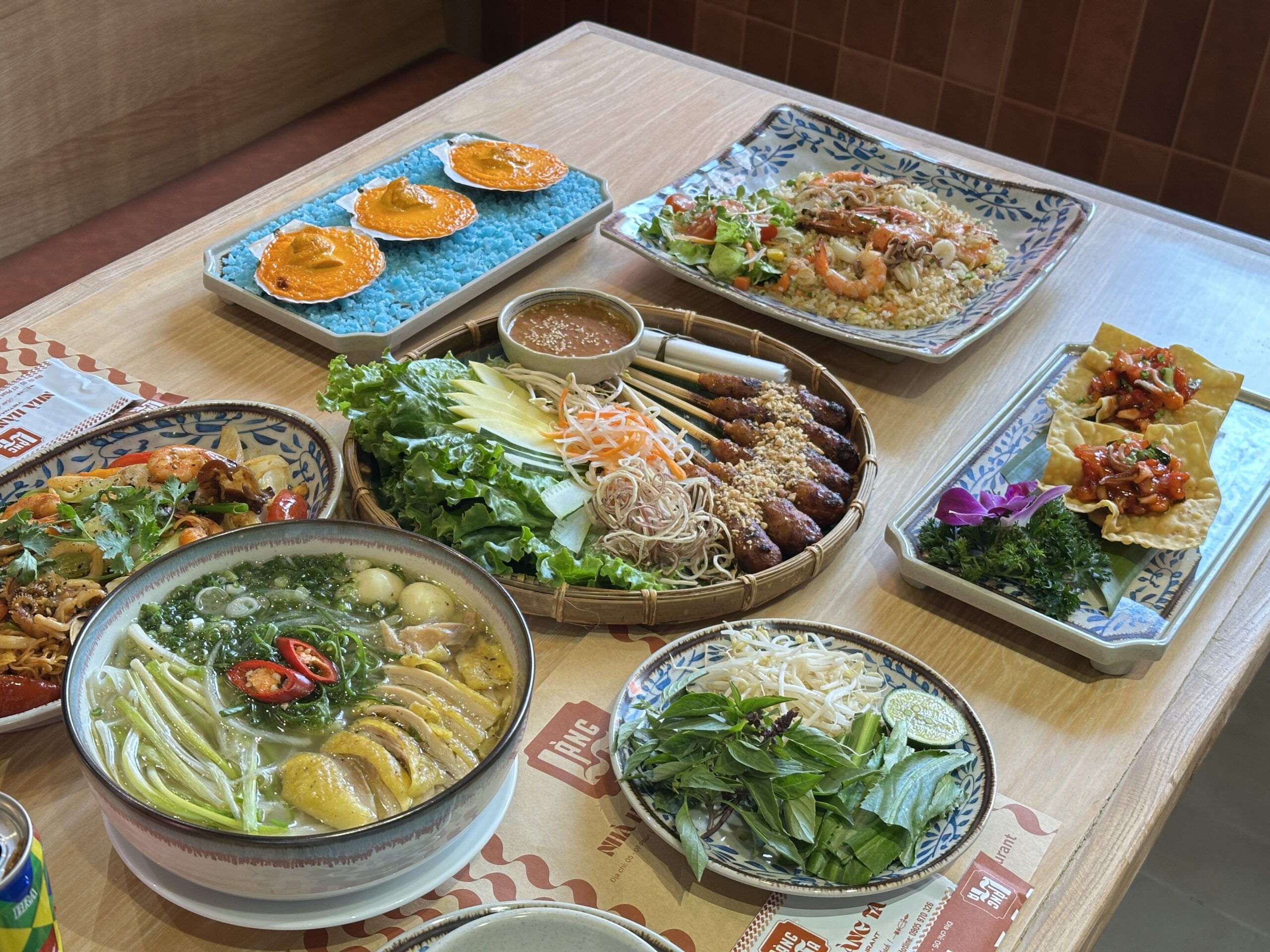 Vietnamese food spread with pho nem lui and fried rice at Lang Ta Da Nang
