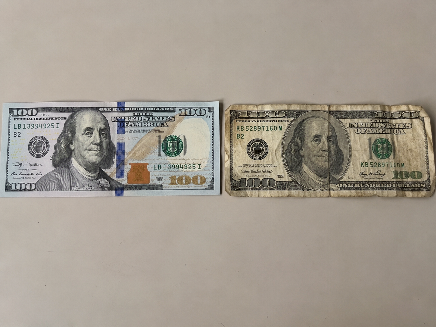 Clean and worn USD 100 banknotes for currency exchange in Vietnam